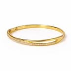 A side view of a gold-plated double-band cross-over bangle for women featuring one polished strand and one strand of brilliant pavé white stones displayed on a white background
