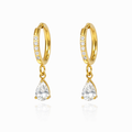 A pair of gold-plated hoop earrings for women featuring a sparkling pear-cut crystal drop, shown on a white background.