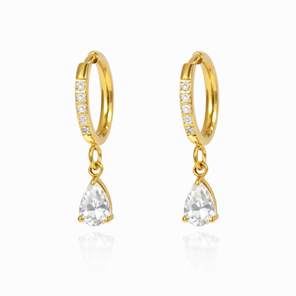 A pair of gold-plated hoop earrings for women featuring a sparkling pear-cut crystal drop, shown on a white background.