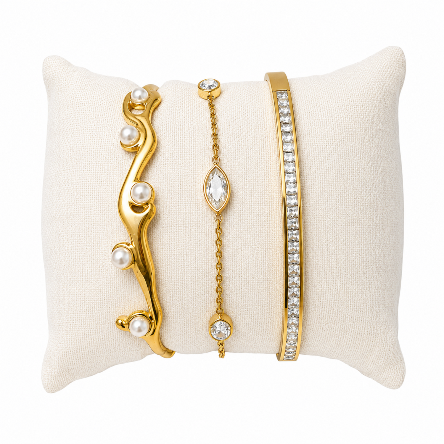 A three-piece gold-plated wrist stack for women featuring a minimalist open cuff, a solid polished kada, and a delicate bezel-set crystal chain bracelet.