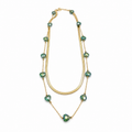 A gold-plated stainless steel chain layered necklace for women featuring a smooth snake chain and a second chain with green faceted heart crystals.