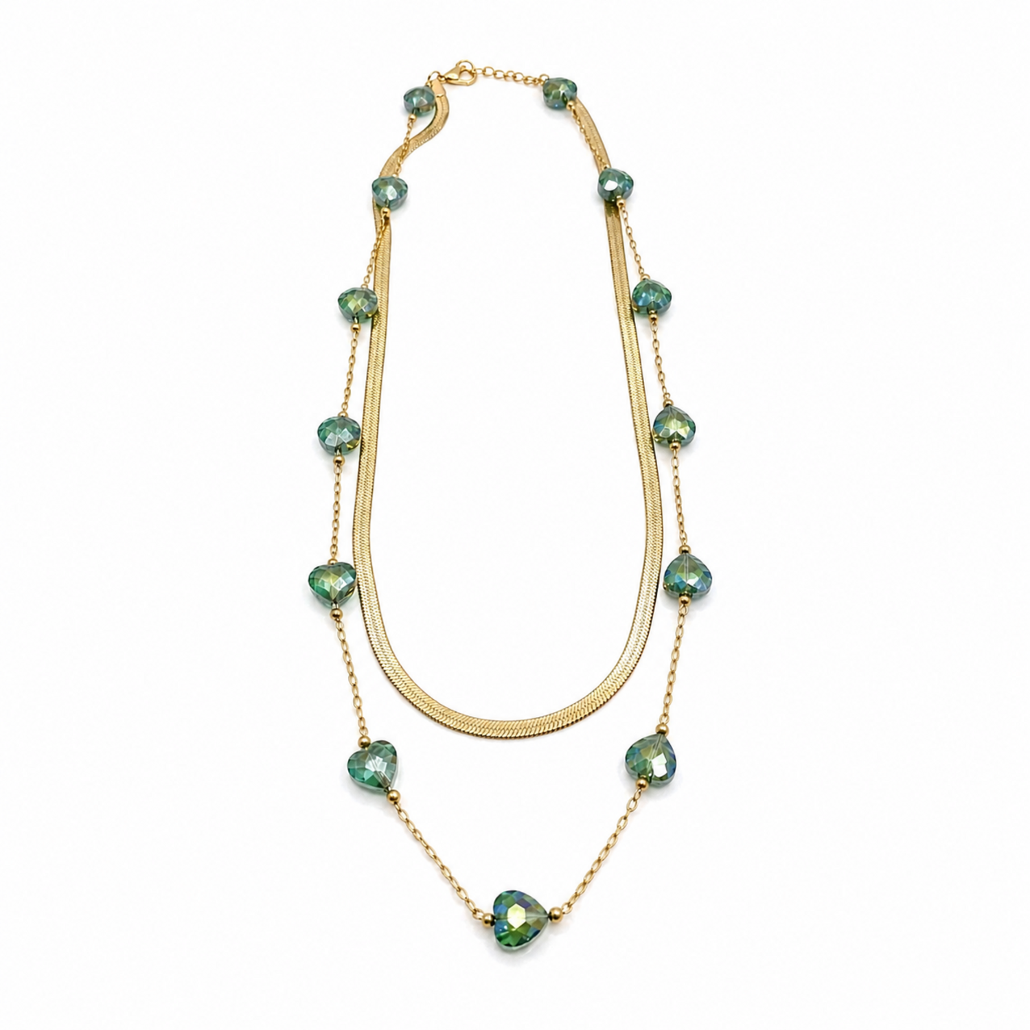 A gold-plated stainless steel chain layered necklace for women featuring a smooth snake chain and a second chain with green faceted heart crystals.