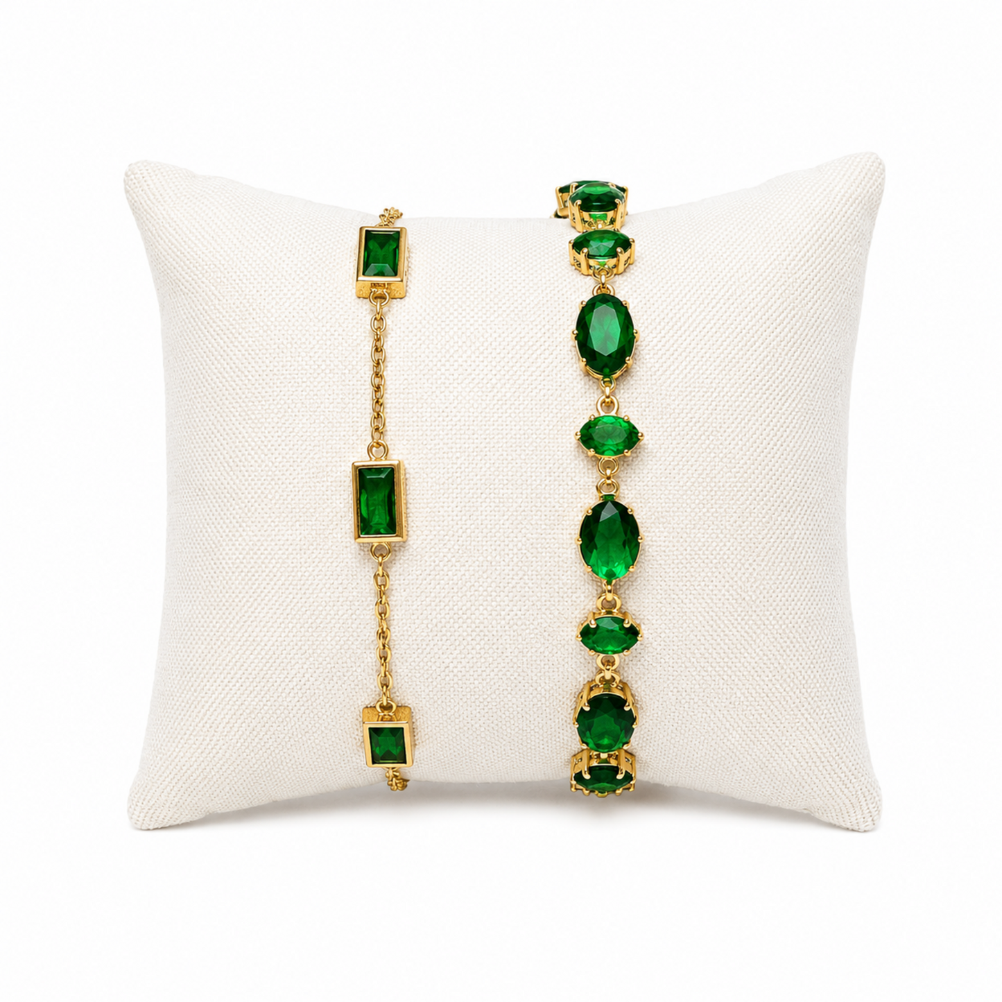 A premium two-piece gold-plated bracelet stack for women featuring the Emerald Horizon Baguette Bracelet and a matching faceted emerald green oval crystal chain bracelet