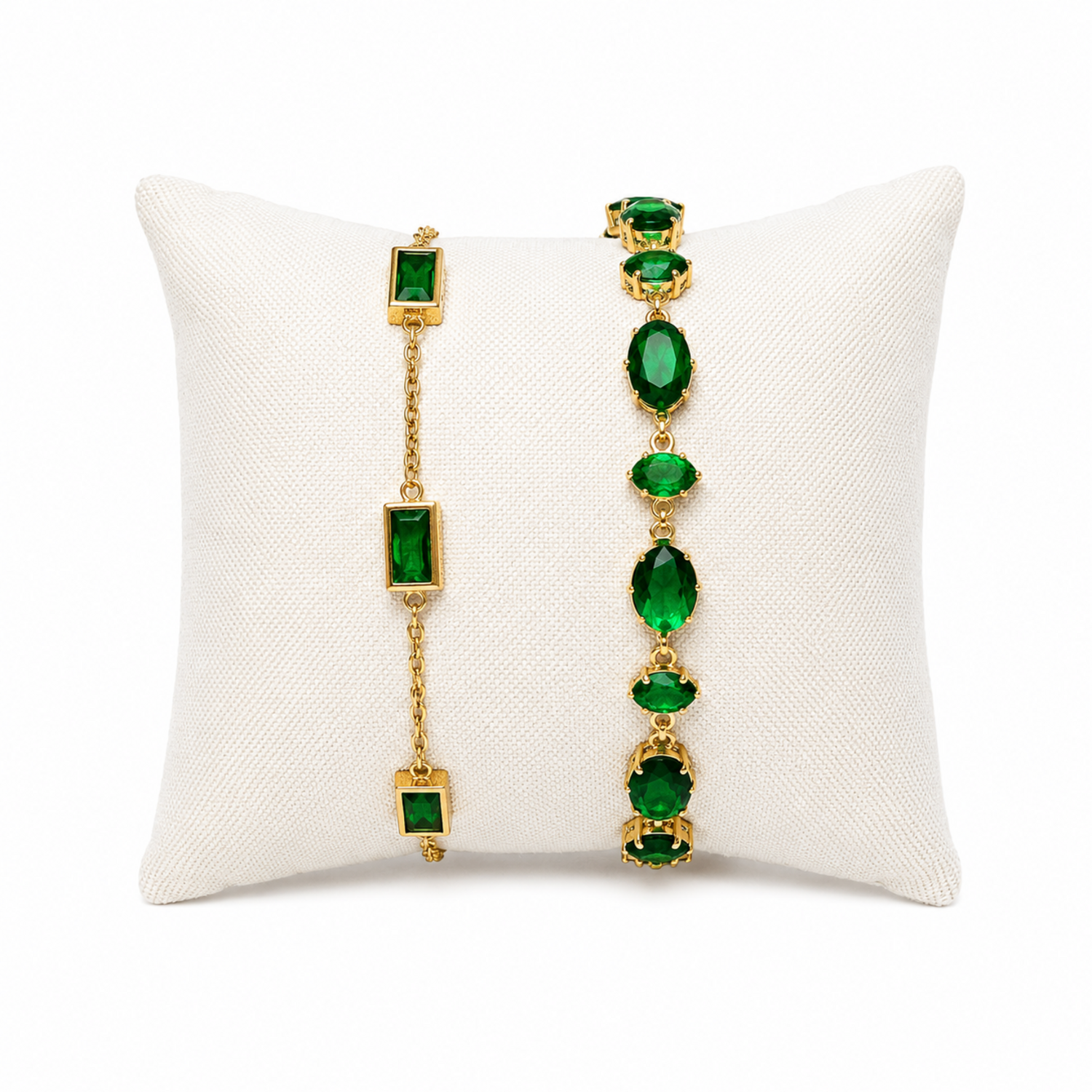 A premium two-piece gold-plated bracelet stack for women featuring the Emerald Horizon Baguette Bracelet and a matching faceted emerald green oval crystal chain bracelet