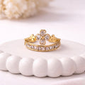 A luxurious gold plated adjustable ring for women featuring four-leaf clover motif eternity band displayed on a white surface