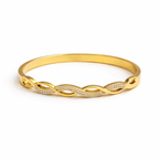 A high-quality gold-plated infinity braid bangle for women featuring pavé-set white stones on a white background