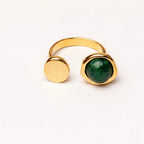 A modern 18kt gold plated stainless steel adjustable ring for women featuring a minimalist open-wrap design on a white background
