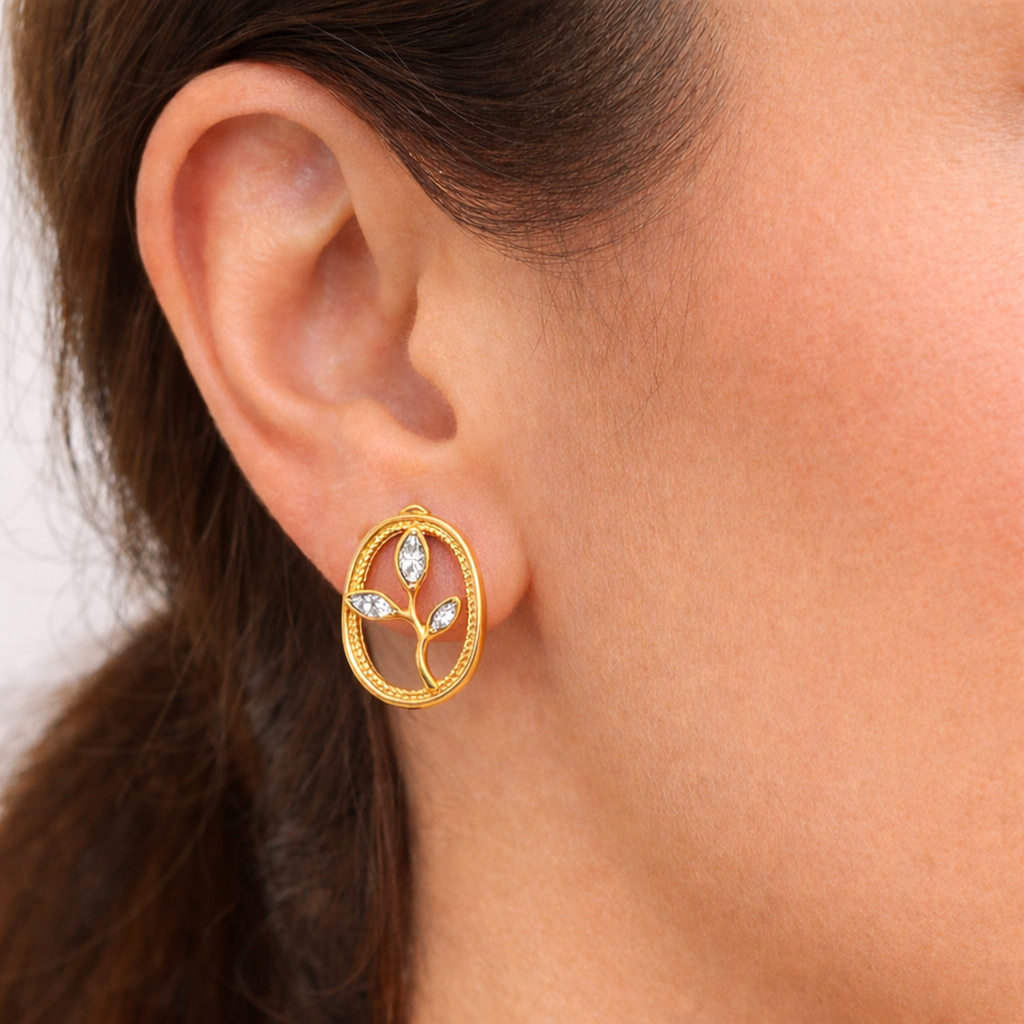 A gold-plated oval stud earrings for women featuring an branch design with three marquise crystal leaves, shown on a model