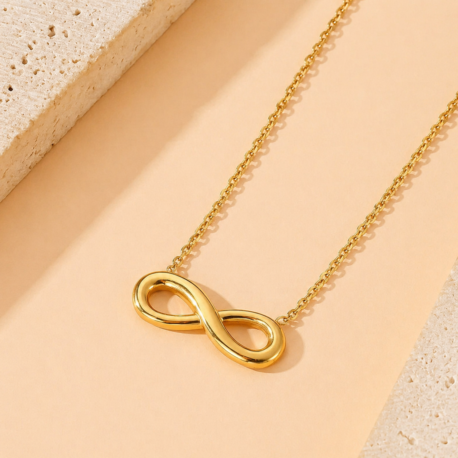 A gold-plated stainless steel chain for women featuring a infinity symbol pendant.