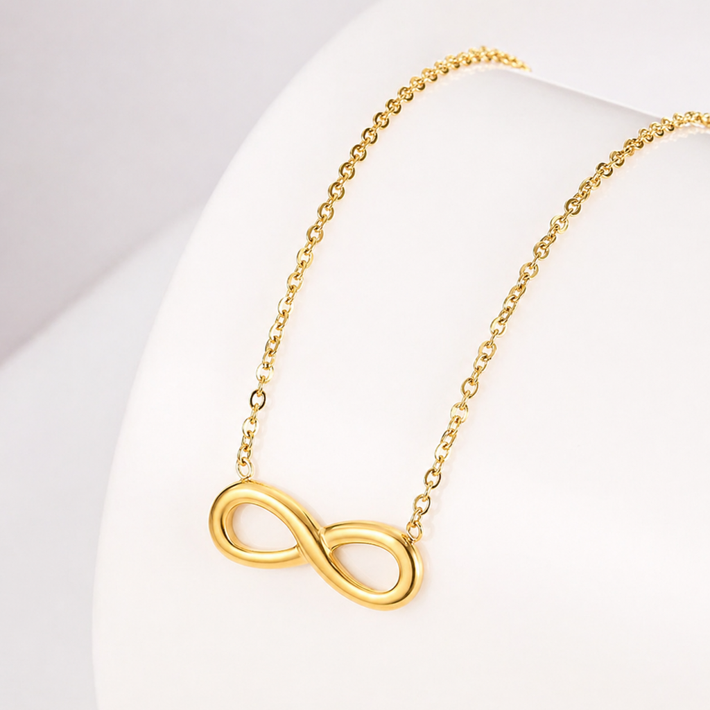 A close-view of a gold-plated stainless steel chain for women featuring a infinity symbol pendant.
