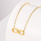 A close-view of a gold-plated stainless steel chain for women featuring a infinity symbol pendant.