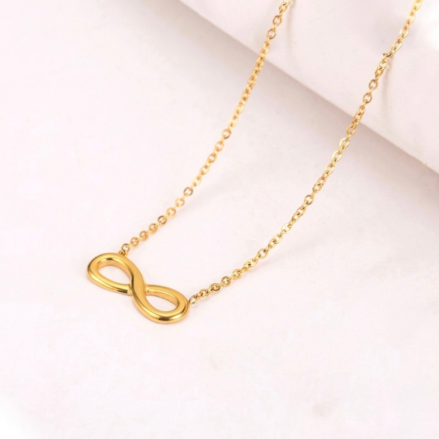 A gold-plated stainless steel chain for women featuring a infinity symbol pendant.