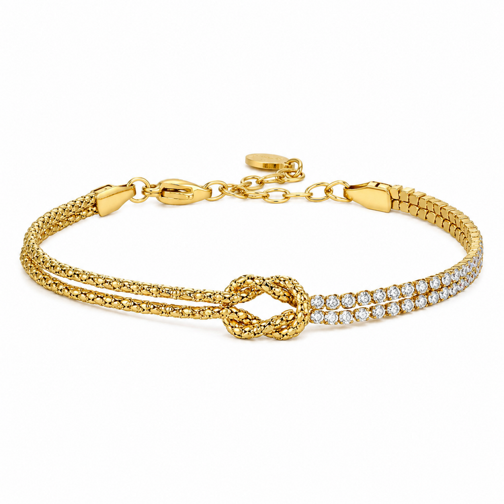A gold-plated chain bracelet for women featuring a central knot, one woven gold strand, and one double-row crystal strand