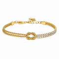 A gold-plated chain bracelet for women featuring a central knot, one woven gold strand, and one double-row crystal strand