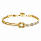 A gold-plated chain bracelet for women featuring a central knot, one woven gold strand, and one double-row crystal strand