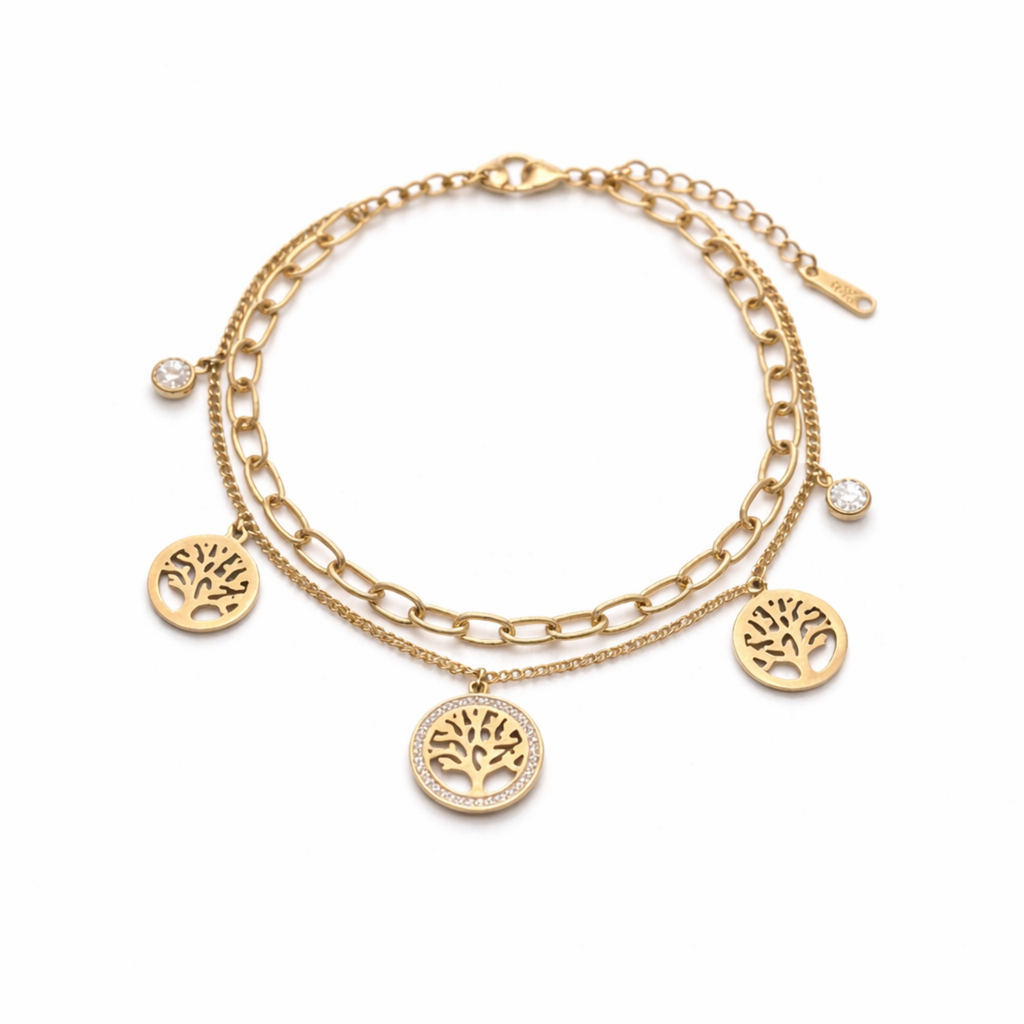 A dual-layer gold-plated chain bracelet for women featuring Tree of Life charms and clear crystal accents, displayed on a white surface