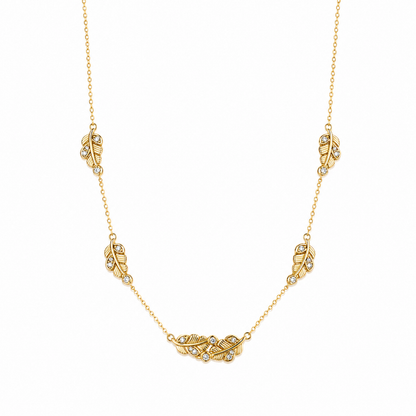 A gold-plated stainless steel chain for women featuring five crystal-accented feather station charms