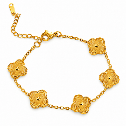 A close-view of a Chain Bracelet with five detailed floral charms on a gold-tone link chain