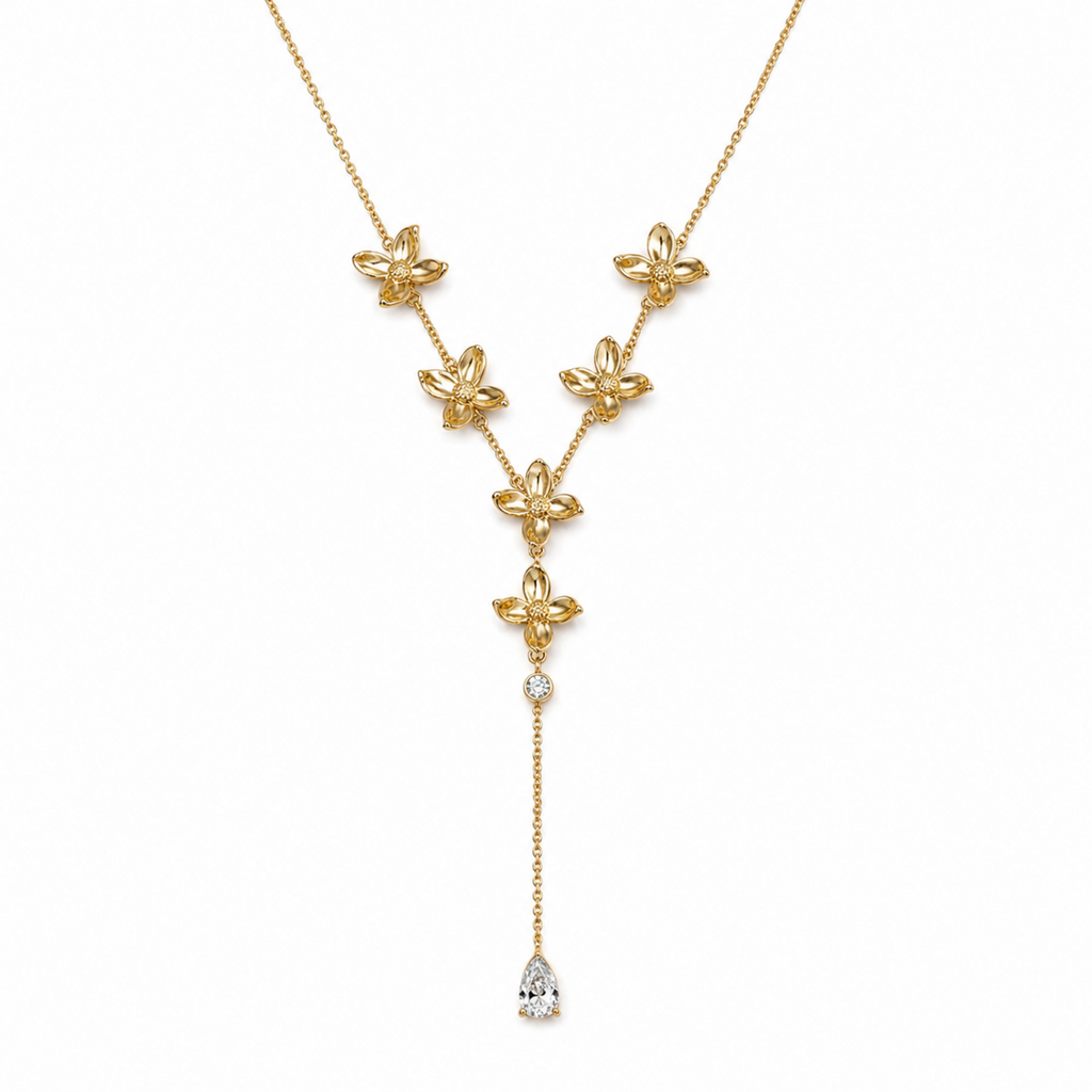 A gold-plated stainless steel chain for women in a Y-drop lariat style, featuring golden flowers and a pear-shaped crystal pendant