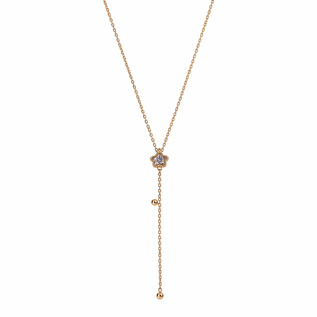 A gold-plated stainless steel Y-shaped necklace for women featuring a small crystal flower pendant and a dangling chain with gold beads, shown on a white background
