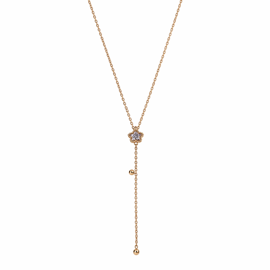 A gold-plated stainless steel Y-shaped necklace for women featuring a small crystal flower pendant and a dangling chain with gold beads, shown on a white background