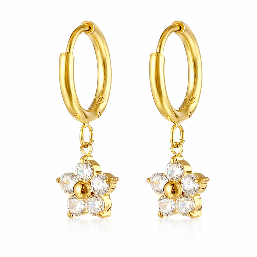 A pair of gold-plated hoop earrings for women featuring a dangling flower-shaped charm made of clear crystals, shown on a white background.