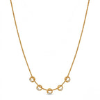 A gold-plated stainless steel chain for women featuring five circular station charms accented with crystals.