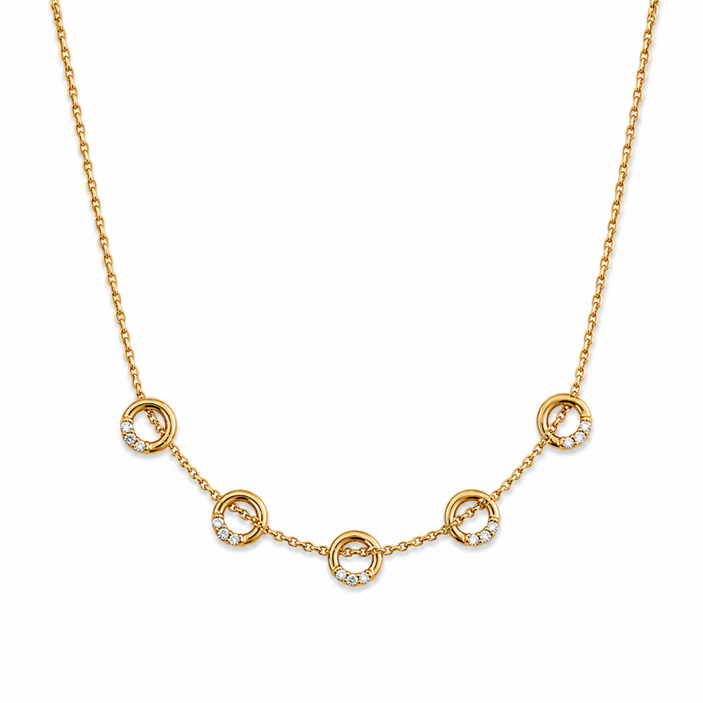 A close-view of a gold-plated stainless steel chain for women featuring five circular station charms accented with crystals.