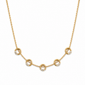 A close-view of a gold-plated stainless steel chain for women featuring five circular station charms accented with crystals.