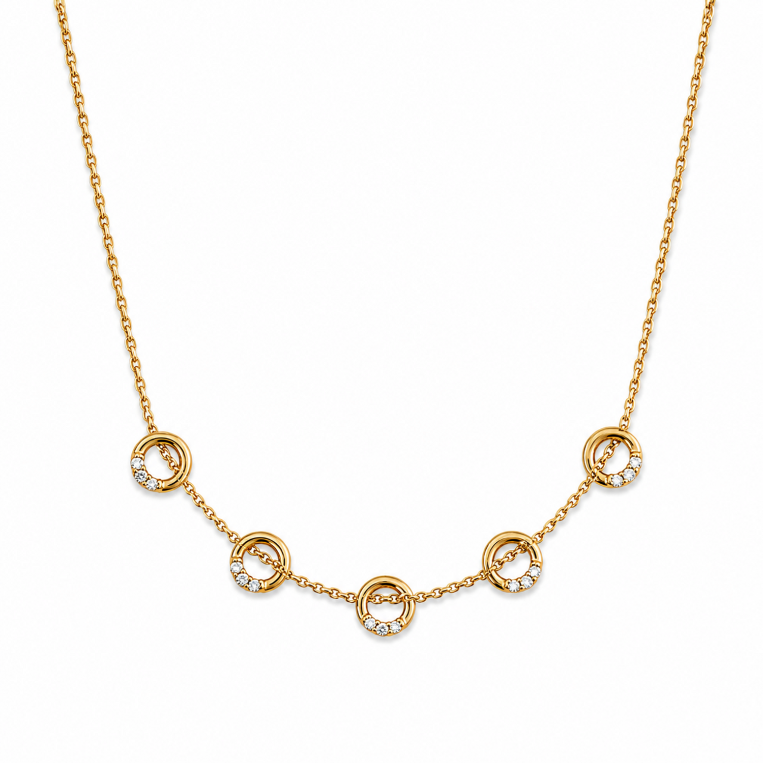 A close-view of a gold-plated stainless steel chain for women featuring five circular station charms accented with crystals.