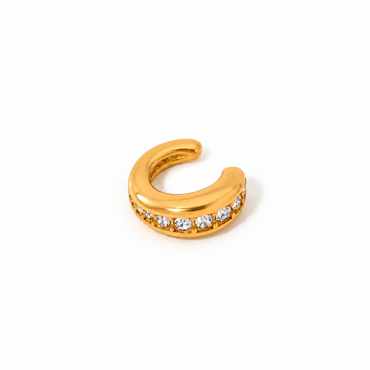 Gold-plated open ear cuff with a smooth rounded band and clear crystals set along the lower edge.