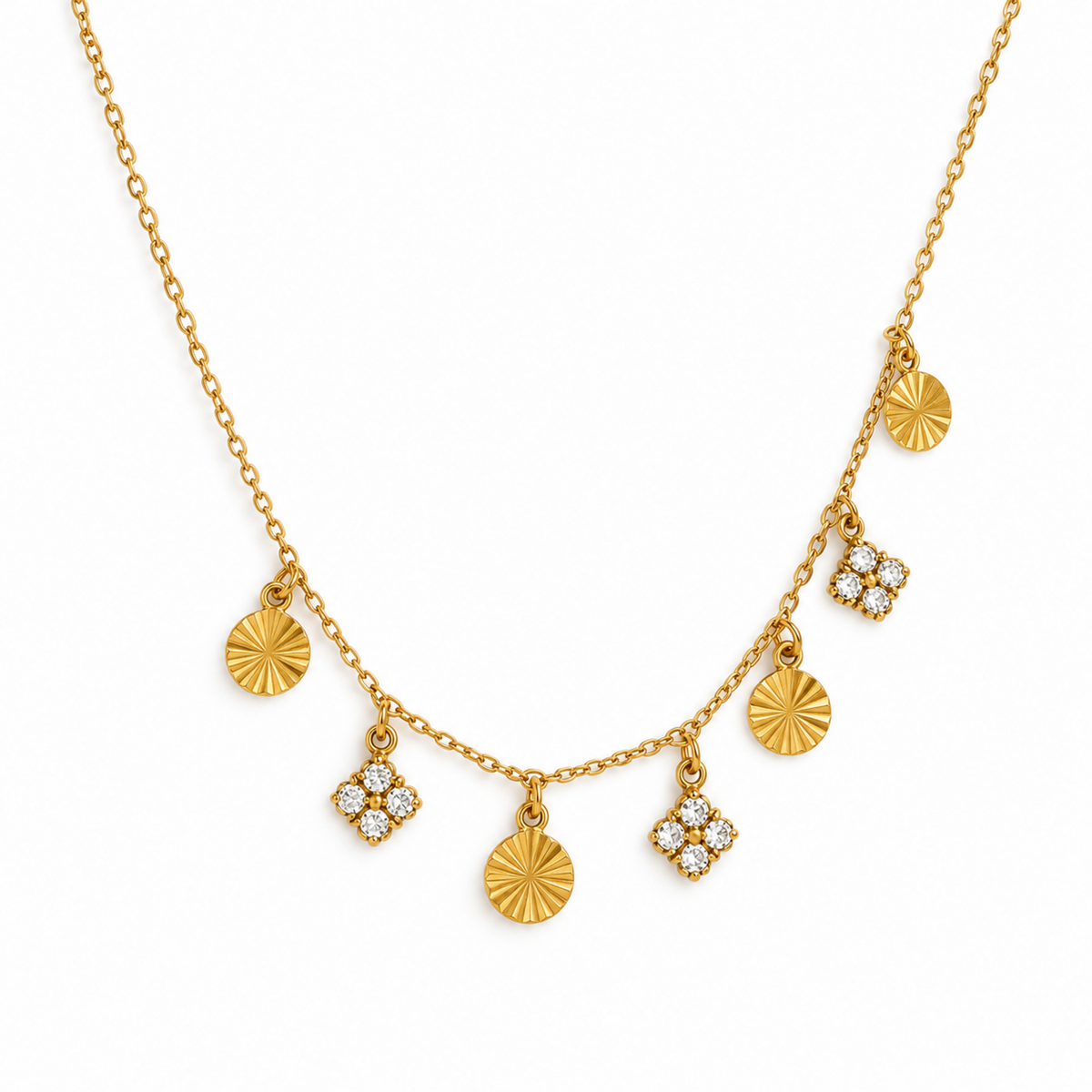 A gold chain necklace with five dangling charms, including two sunburst disc pendants, one round disc, and two diamond cluster pendants, shown on a plain white background.
