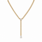 A gold-plated stainless steel chain for women in a Y-drop lariat style featuring a vine-like beaded link and teardrop crystal