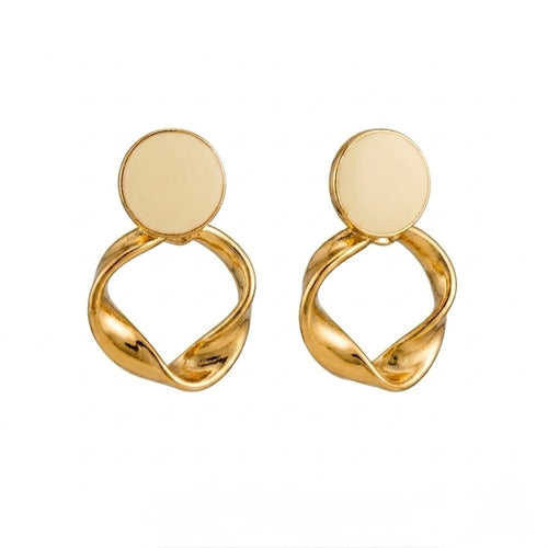 A pair of gold-plated statement earrings for women featuring a flat circular stud and a sculptural twisted hoop pendant, shown against a clean white background.
