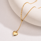 A gold-plated stainless steel chain for women featuring a Y-shaped lariat design with a polished 3D puffed heart pendant