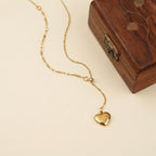 A gold-plated stainless steel chain for women featuring a Y-shaped lariat design with a polished 3D puffed heart pendant