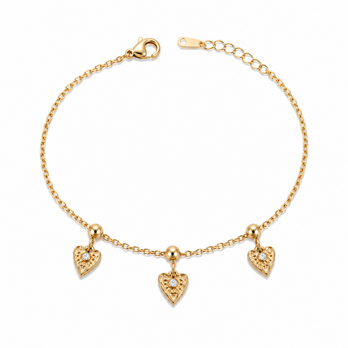 A gold-plated ladies bracelet with a fine chain featuring three dangling filigree-engraved hearts and sparkling crystal centers.
