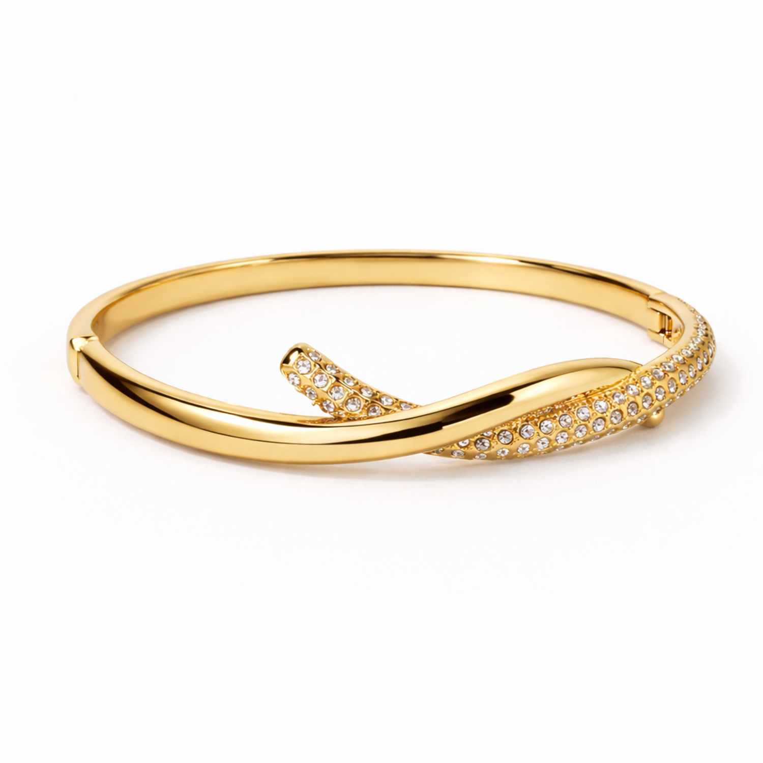 A side-view of a gold-plated twisted hinge bangle for women featuring a continuous row of sparkling white stones on a white background