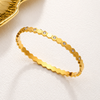 A gold-plated hexagonal bangle for women featuring inlaid brilliant crystals and a secure side-hinge clasp