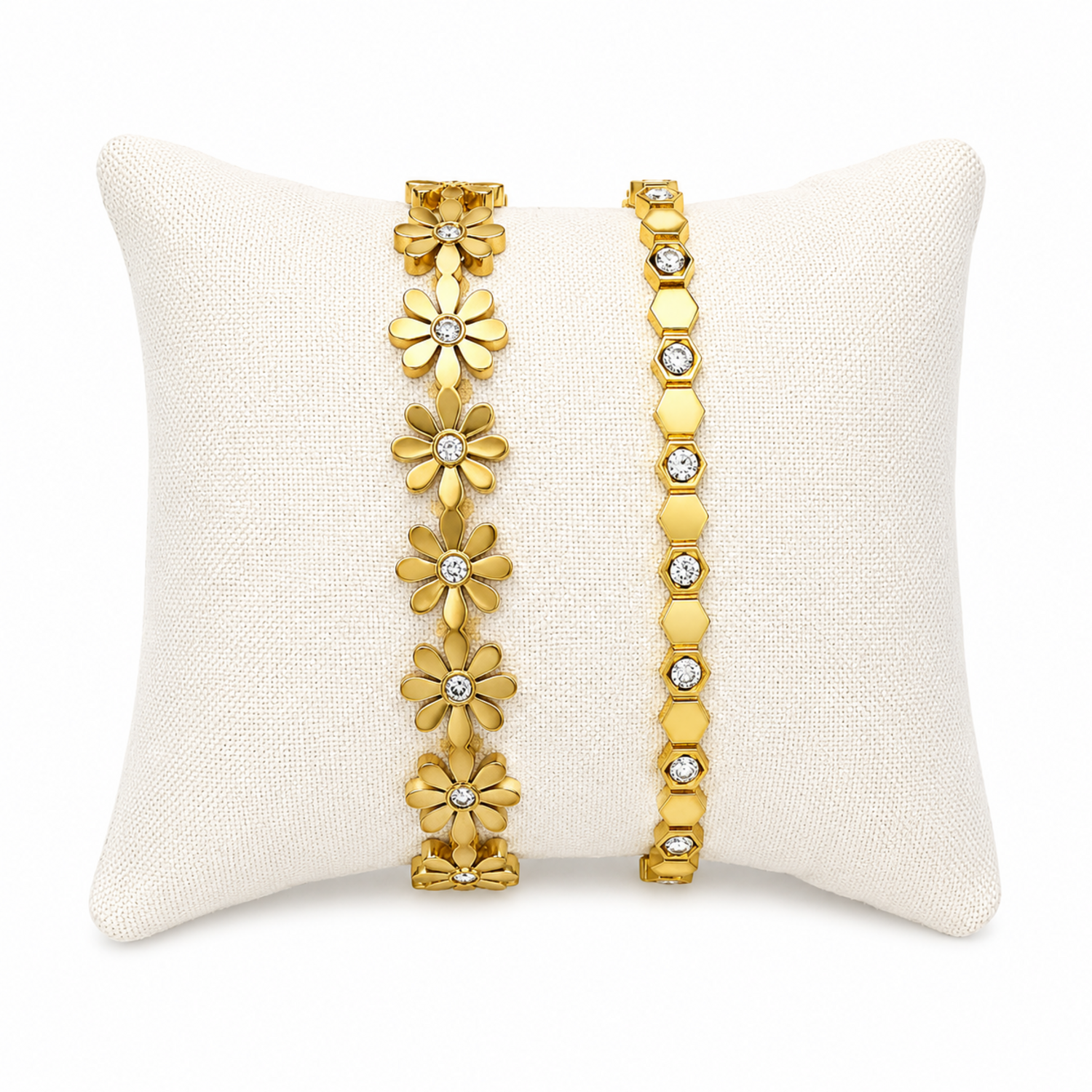 A premium two-piece gold-plated structural bracelet stack for women featuring a geometric crystal honeycomb bangle and a polished gold floral station bangle