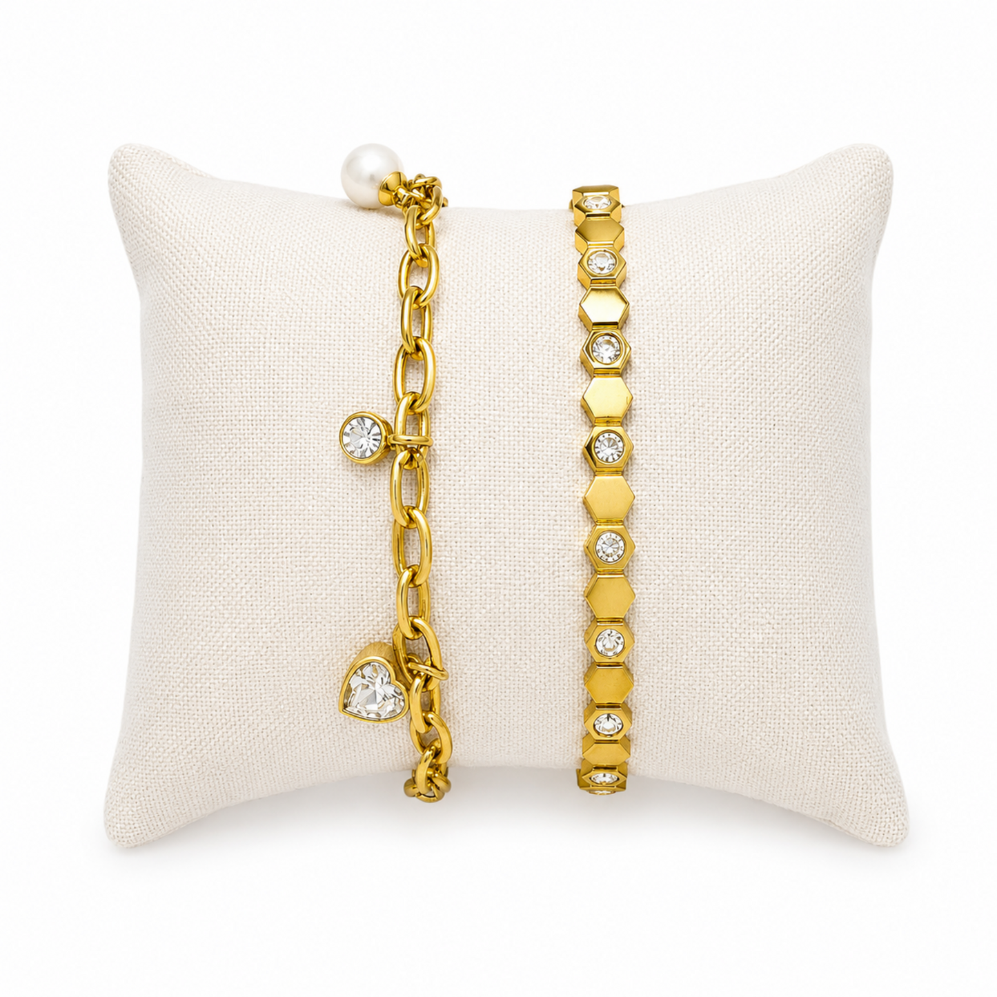 A premium two-piece gold-plated bracelet stack for women featuring a chunky paperclip charm chain with a pearl and heart drop next to a geometric honeycomb crystal bangle