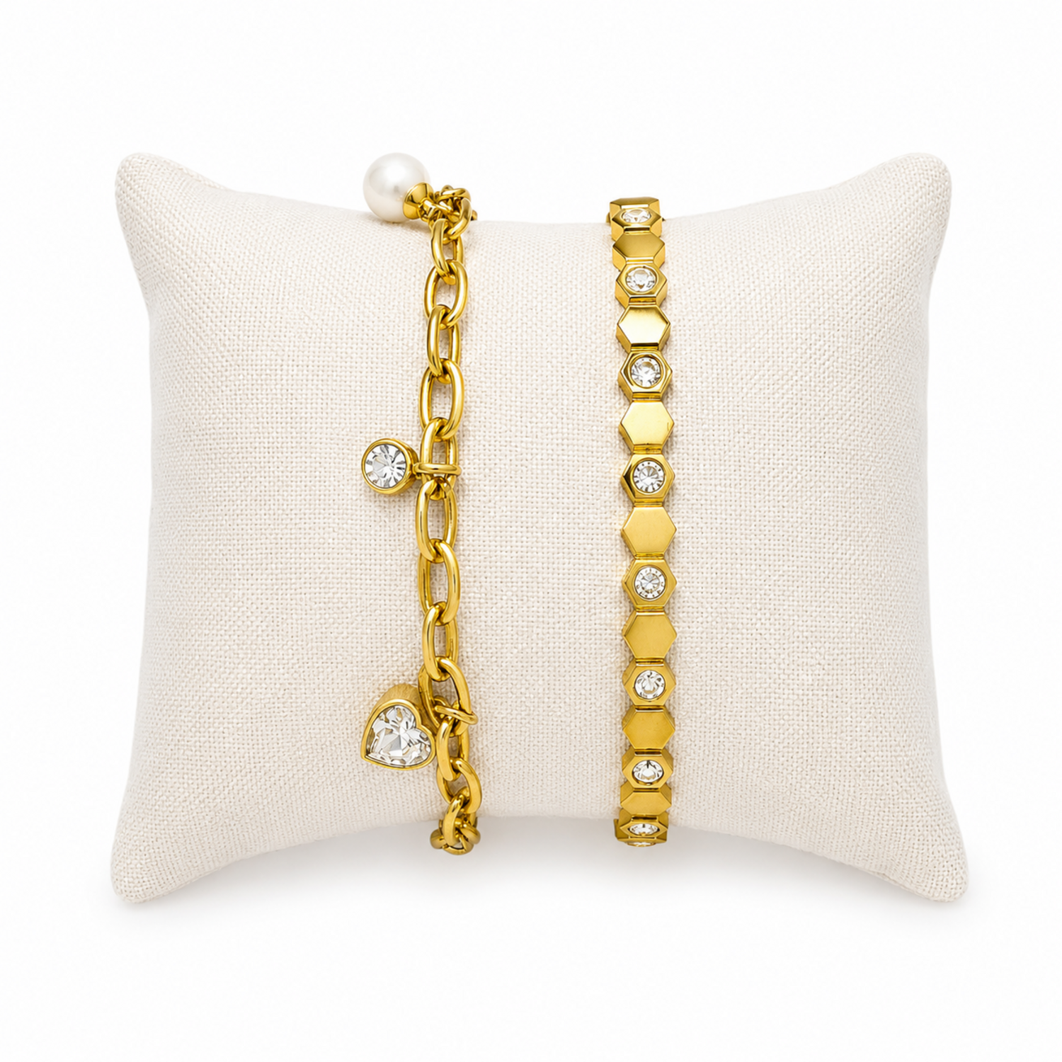 A premium two-piece gold-plated bracelet stack for women featuring a chunky paperclip charm chain with a pearl and heart drop next to a geometric honeycomb crystal bangle
