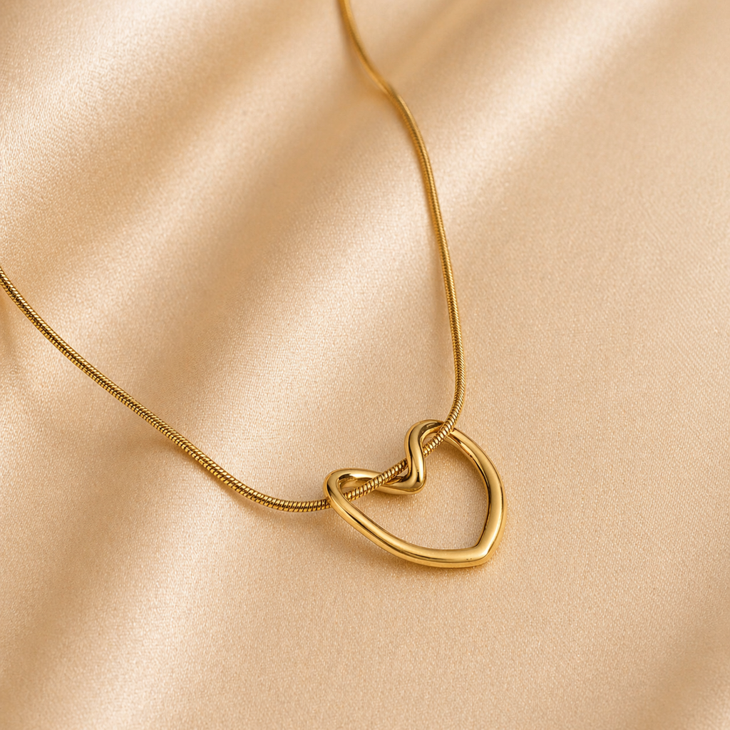A gold-plated stainless steel chain for women featuring open-heart pendant intertwined with a sleek chain