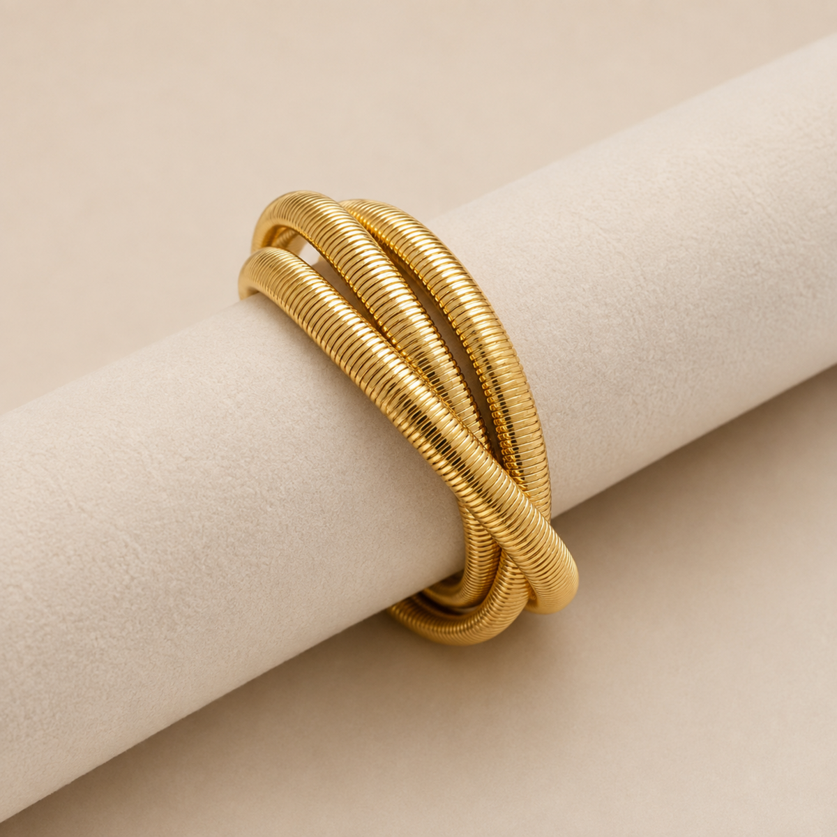 18K gold plated trio snake chain bangle for women featuring three intertwined ribbed chains with a polished anti-tarnish finish on display
