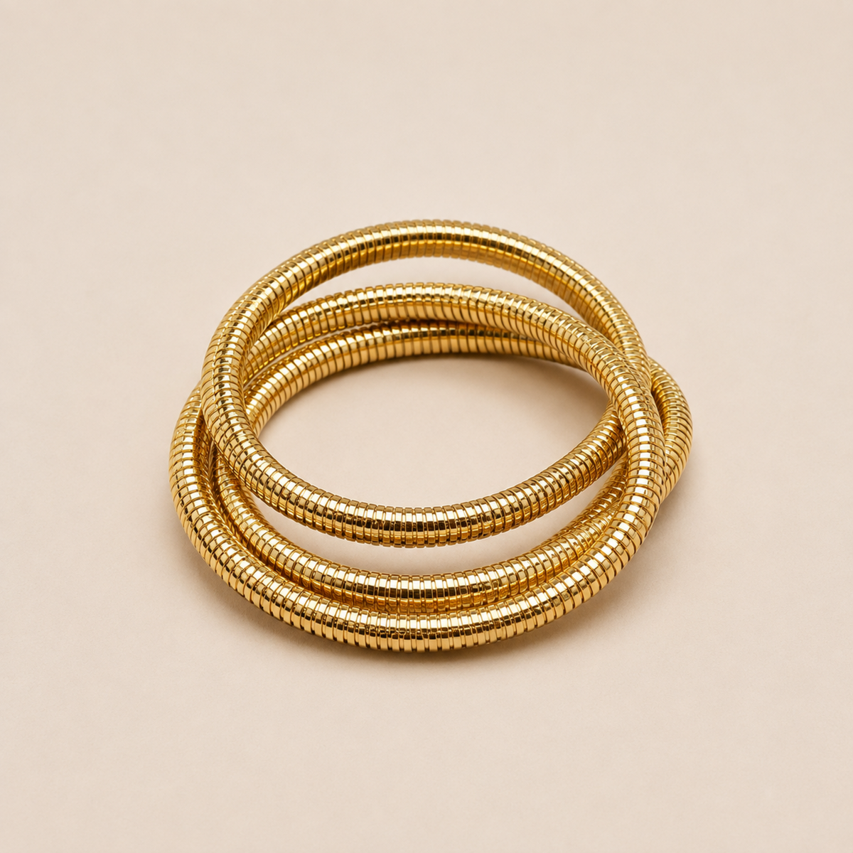 18K gold plated trio snake chain bangle for women featuring three intertwined ribbed chains with a polished anti-tarnish finish