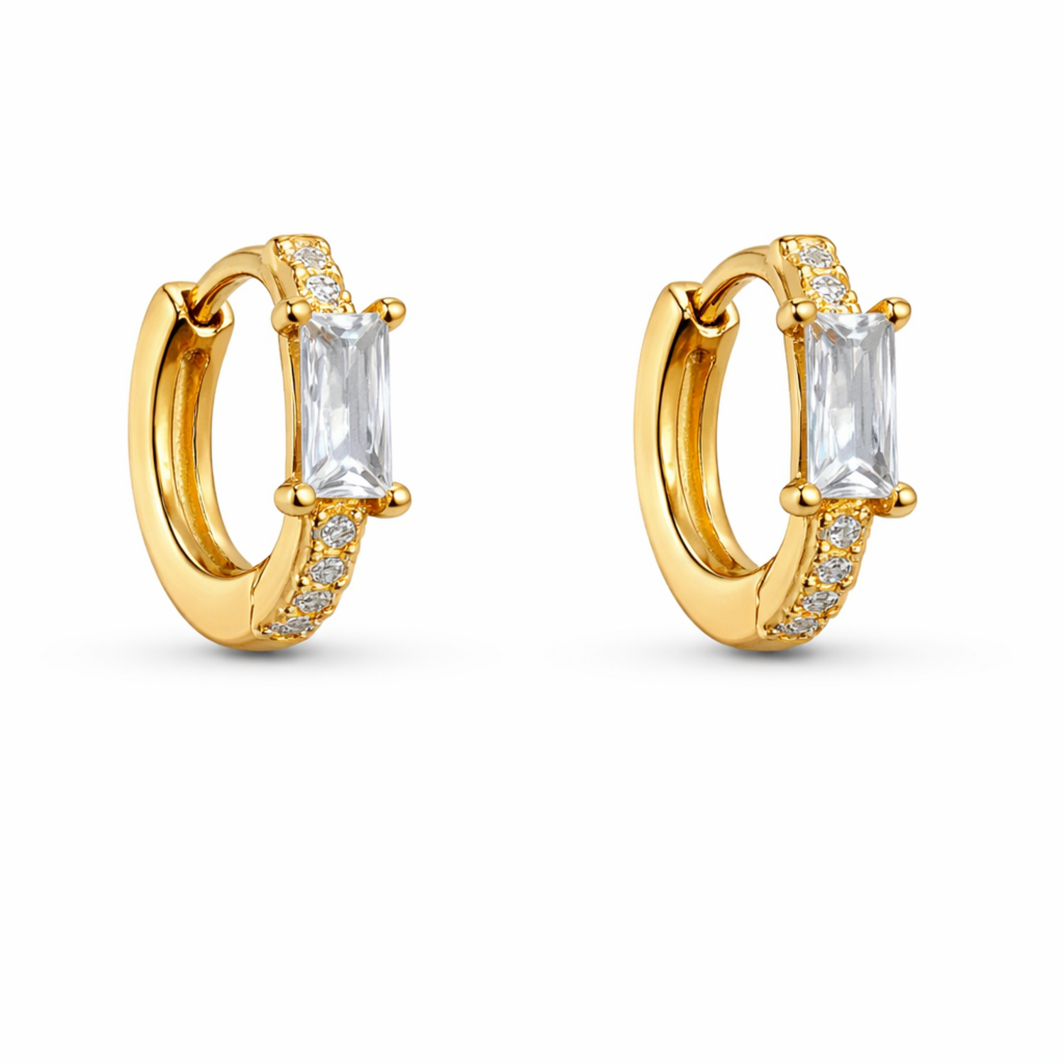 A gold-plated huggie hoop earrings for women featuring a central baguette-cut clear crystal, shown on a clean white background.