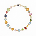 A close-view of a gold-plated multi-colored stone chain bracelet for women shown on a white background