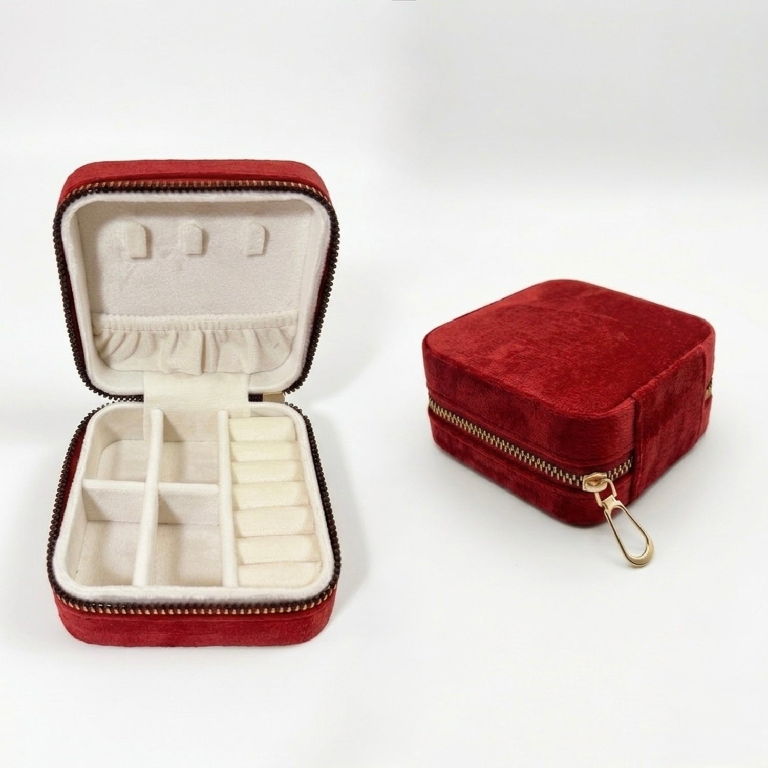 velvet travel size jewellery box organizer in wine red color with golden zipper displayed both closed and open view showing compartments on a flat surface