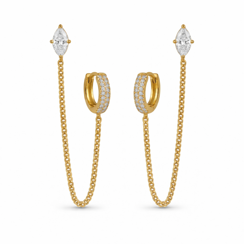 A pair of gold-plated ear chain earrings for women connecting a crystal hoop to a marquise-cut crystal stud with a fine gold plated chain