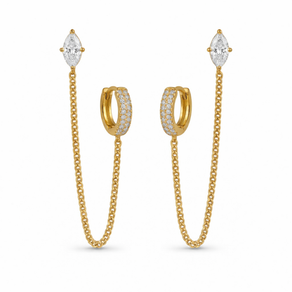 A pair of gold-plated ear chain earrings for women connecting a crystal hoop to a marquise-cut crystal stud with a fine gold plated chain